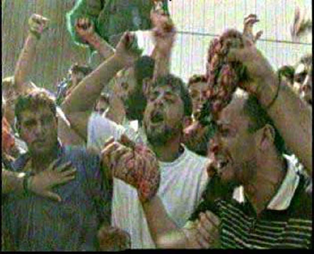 Arabs%20waving%20entrails%20of%20butchered%20Israelis%20in%20Ramallah.jpg